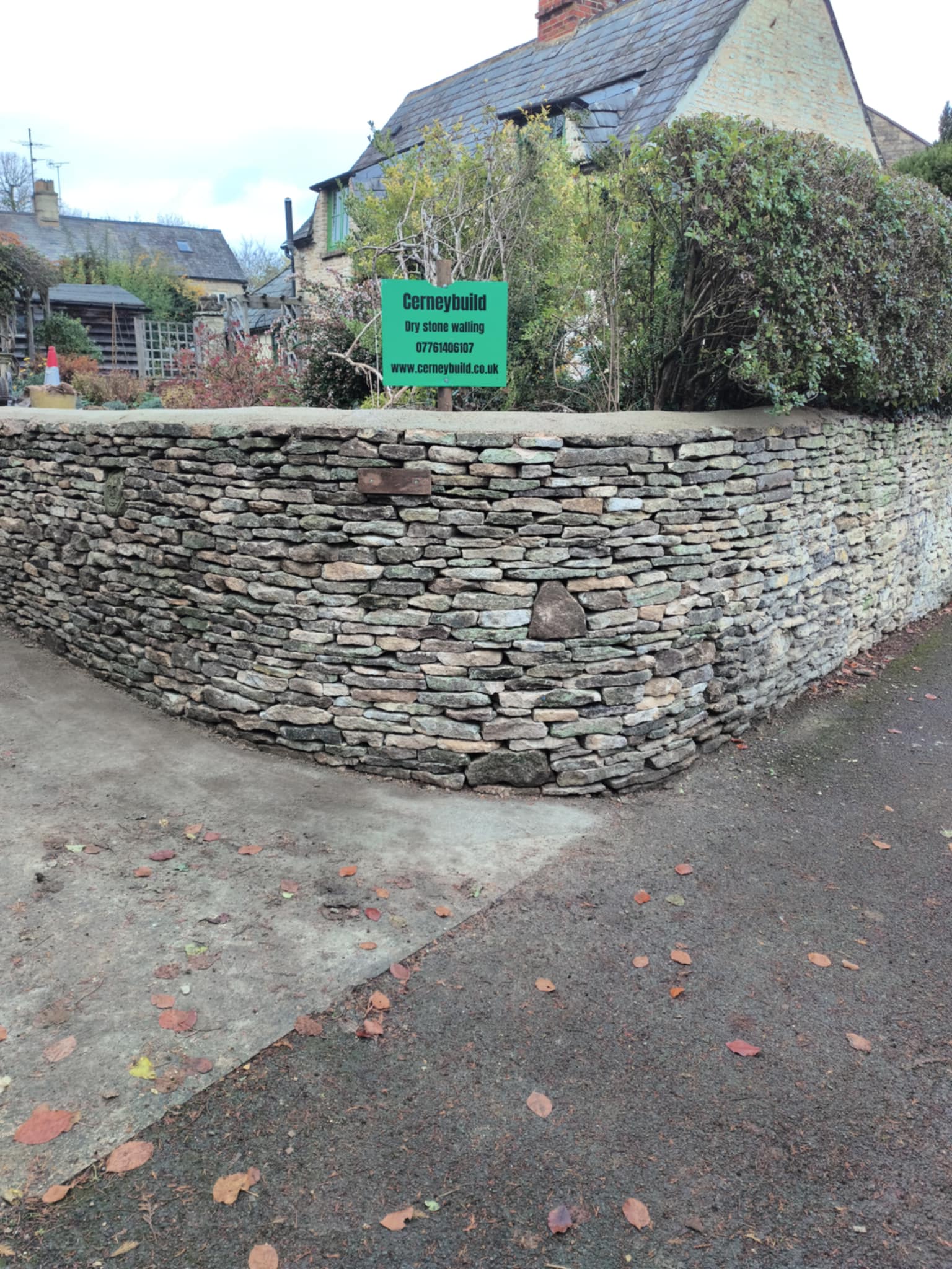 Dry stone waller in Cirencester working on a Cotswolds stone wall