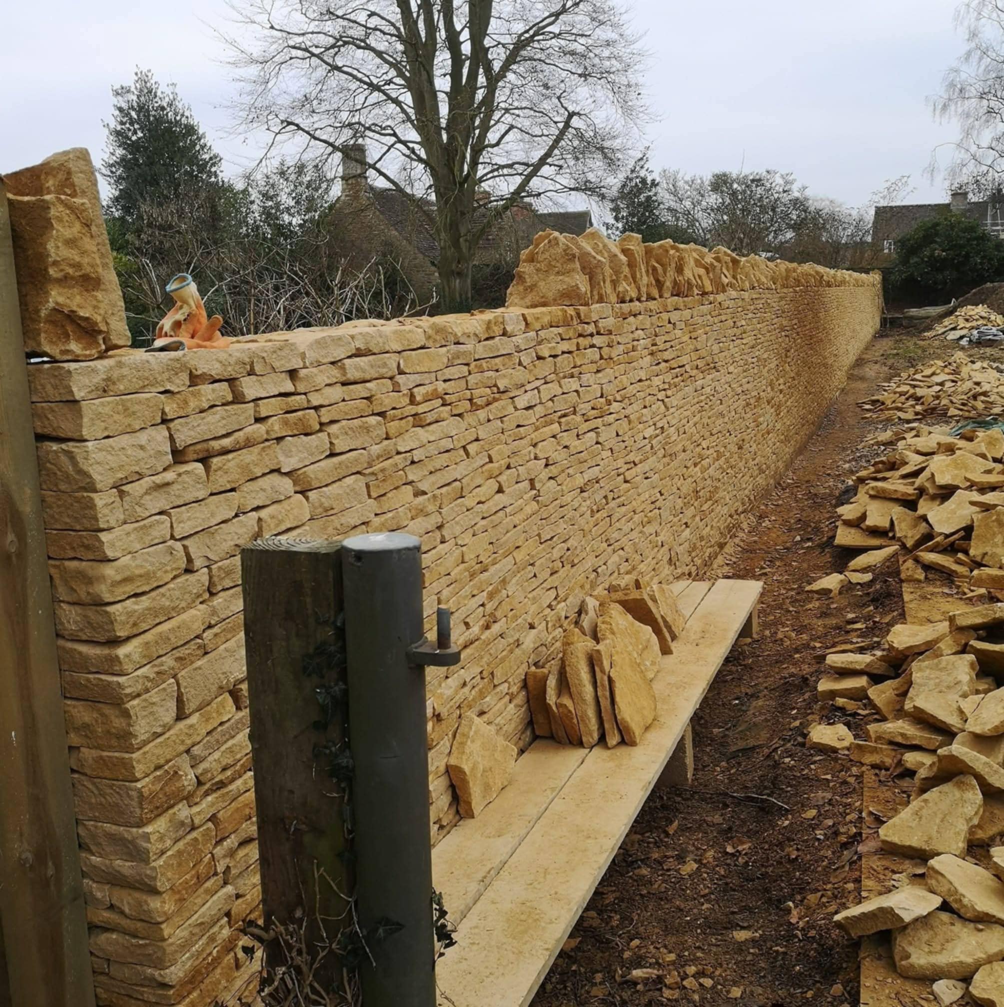 Traditional dry stone wall in Cirencester built by hand